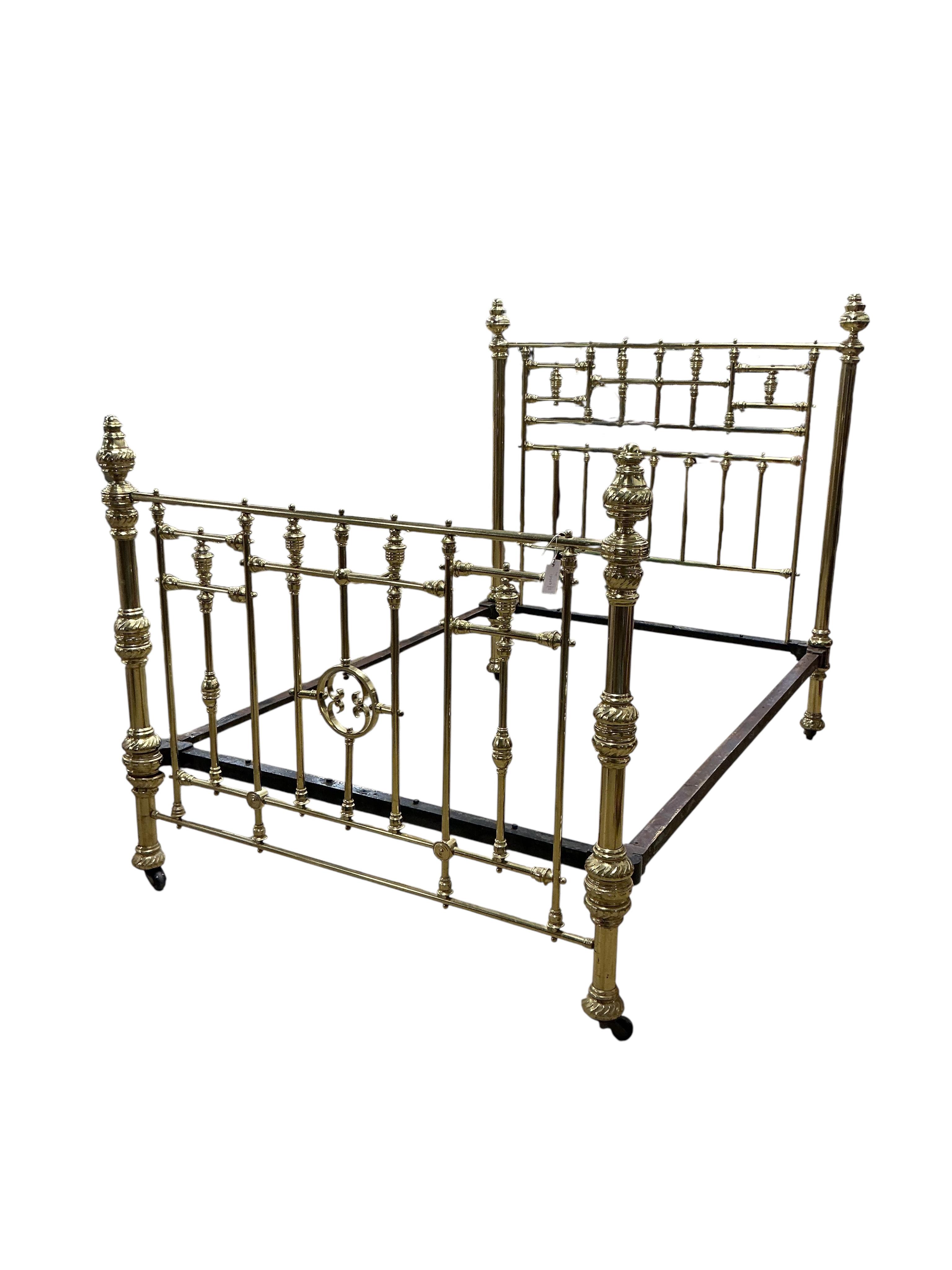 A Victorian brass bed frame, width 141cm, length 204cm, height 160cm